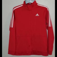 Adidas Zip Track Jacket - Youth Large/Xl. Perfect Condition, Very Clean! Never Worn! Adidas Long Sleeve Winter Track Jacket, Adidas Winter Track Jacket Long Sleeve, Adidas Red Winter Tops, Red Adidas Tops For Winter, Adidas Sporty Red Outerwear, Red Sporty Adidas Outerwear, Sporty Red Adidas Outerwear, Red Hooded Adidas Outerwear, Red Adidas Winter Outerwear