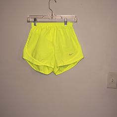 Never Worn Nike Shorts Size Small Nike Shorts With Built-in Liner For Spring, Nike Athletic Shorts For Spring, Sports Pants With Built-in Shorts For Spring, Yellow Athletic Shorts With Built-in Shorts For Spring, Nike Stretch Bottoms For Spring, Nike Yellow Workout Shorts, Stretch Yellow Nike Bottoms, Yellow Stretch Nike Bottoms, Nike Stretch Yellow Bottoms