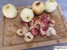 sliced apples and onions on a cutting board ready to be cut into bite sized pieces