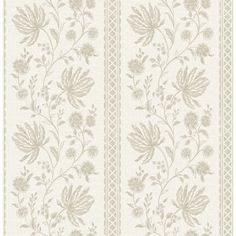 a white and beige wallpaper with flowers on the side, in an ornate pattern