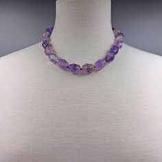 "Necklace length: 18\"L with 1.5\"L extender. Major beads: -Labradorite: faceted barrel shaped. -Amethyst: faceted barrel shaped. -Prehnite: faceted barrel shaped. -Lapis Lazuli: faceted barrel shaped.. Style: Beaded semi-precious stone necklace. Color: -Labradorite: Blue and multi-color. -Amethyst: Purple and Lavender. -Prehnite: Gren. -Lapis Lazuli: Blue. Clasp: 13MM sterling silver lobster clasp and closed jump ring. Finding: N/A. Workmanship: Hand beaded, and each bead is knotted in mixed co Adjustable Lavender Single Strand Necklace, Adjustable Single Strand Amethyst Necklace, Adjustable Single Strand Crystal Necklace For Healing, Amethyst Crystal Necklace For Healing, Adjustable Lavender Gemstone Necklace, Adjustable Single Strand Lavender Beaded Necklace, Adjustable Lavender Single Strand Beaded Necklace, Adjustable Purple Necklace With Faceted Beads, Adjustable Single Strand Amethyst Crystal Necklace