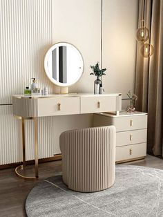 a dressing table with a round mirror and stool