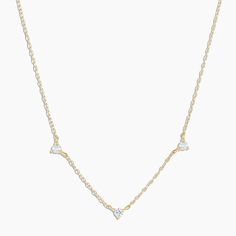 This dainty 14k gold everyday chain features three delicate, eye-catching diamonds. This necklace is perfect solo, or peeking out between your favorite gold layers. Product Details 0.06 total carat weight Three 2 mm genuine GH SI1 - SI2 diamonds 14k solid gold 15" chain + 2" extender. Adjustable in 1" increments 15" - 17" Spring ring closure | Diamond Eve Necklace in Gold, Women's in 14k gold by Fine Trio Necklace, Gorjana Jewelry, Dainty Diamond Necklace, Black Labradorite, Orange Agate, Yellow Opal, Iridescent Crystal, Pink Enamel, Blue Lace Agate