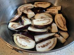 sliced up eggplant in a metal bowl