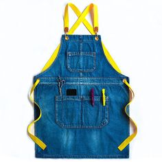 a blue jean apron with yellow straps hanging from it's front and side pockets