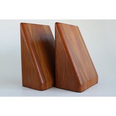 pair of wooden salt and pepper shakers in the shape of pyramids on white background