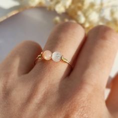 ✨ Moonstone & Sunstone Ring, 14K Gold Filled, Rose Gold Filled, Sterling Silver Wire Wrapped Ring, Moon and Sun Jewelry ✨💙 Simple two-stone wire ring with moonstone & sunstone beads, the two gemstones that represent the Moon and the Sun. Very dainty and precious ring for every day wear & a wonderful gift. Sizing: •Gemstone size: 4 mm•Ring Band:  0.8 mm 🌛 Moonstone helps to bring calm, peace, and balance. Moonstone is believed to has soothing energy which heals anxiety and worries. Handmade Moonstone Ring For Gift, Handmade Delicate Moonstone Ring For Gift, Adjustable Wire Wrapped Moonstone Ring, Wire Wrapped Rings Moon, Dainty Wire Wrapped Crystal Ring, Retro Rings, Quartz Rings, Moon Accessories, Sunstone Ring