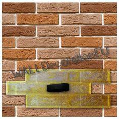 a brick wall with a black hole in the middle and yellow bricks below it that says,