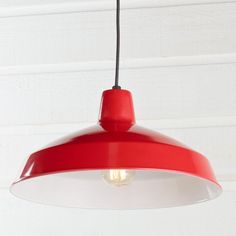 a red and white light hanging from a ceiling