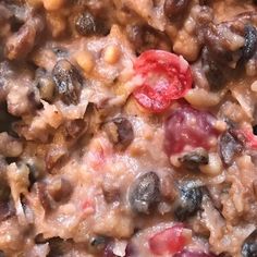 a close up view of some food that is mixed in with other foods and vegetables