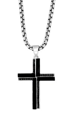 A meaningful keepsake for a loved one or a sentimental addition, this handcrafted sterling-silver necklace is anchored with a deeply symbolic cross pendant. 22" length; 0.89"W x 1.53"L pendant Sterling silver/onyx Made in the USA Black Spiritual Jewelry For Father's Day, Spiritual Black Jewelry For Father's Day, Black Engraved Cross Pendant Necklace, Black Sterling Silver Jewelry For Father's Day, Stainless Steel Cross Pendant Necklace With Box Chain, Black Engraved Crucifix Necklace, Father's Day Black Sterling Silver Necklace, Black Cross Pendant Necklace Gift, Black Crucifix Necklace Engraved