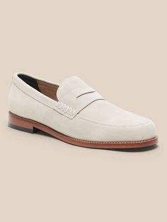 A timeless penny loafer, this sumptuously soft suede shoe preserves the traditional look with the signature penny slot across the vamp, updated here in a more modern shape.  Designed with lightweight, durable OrthoLite® performance insoles for breat Classic Suede Semi-formal Slip-ons, Classic Suede Moc Toe Oxfords, Classic Suede Slip-ons With Almond Toe, Classic Suede Loafers With Rubber Sole, Classic Suede Moccasins With Round Toe, Classic Suede Plain Toe Loafers, Classic Plain Toe Suede Loafers, Classic Suede Moc Toe Loafers, Classic Slip-on Suede Dress Shoes