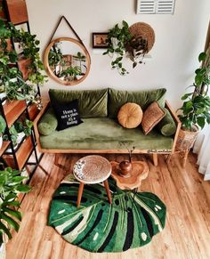 a living room filled with furniture and plants