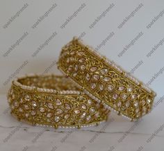 The Premium quality Antique gold finish handcrafted high-quality reverse Polki bangles with beaded pearl on edge. Non-openable style. Size: 2.4, 2.6 & 2.8 Comes 2 in a set. Antique gold finish. *Color may vary slightly due to light condition & photography. Jewelry Care: Keep away from moisture. Allow perfumes and lotion to dry before wearing. Store in jewelry pouch. Clean only with soft lint free cloth. Polki Bangles, Photography Jewelry, Pearl Set, Jewelry Pouch, Jewelry Care, Gold Finish, Antique Gold, Lotion, Premium Quality