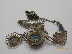 "Vintage silver or silver tone wire & blue crystal cabochons necklace. Necklace is 17\" with a 2\" dangle consisting of crystals & a lobster claw fastener. This is an estate item. All pieces are in very good condition. All parts are present and intact. This has possibly been repaired. No info available." Silver Glass Cabochon Necklaces, Wire Wrapped Metal Dangle Necklaces, Silver Glass Cabochon Necklace, Silver Necklace With Cabochon Glass, Metal Wire Wrapped Costume Jewelry, Silver Glass Costume Jewelry, Metal Cabochon Necklace In Costume Jewelry Style, Silver Wire Wrapped Costume Jewelry, Blue Metal Cabochon Jewelry