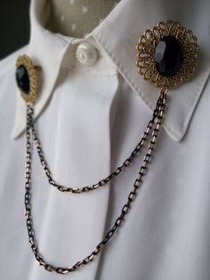 Statement vintage collar pin chain. It's been setted by hand with New Old Stock (unused) 80s pieces. Elegant victorian style gold beonze filigrees with black central faceted cabochon linked by brass chains in black and gold. The chains are the only piece which isn't vintage. The cabochons and the filigree are sturdy and strong. Made of plastic but really metal/ glass looking. ALL THE VINTAGE JEWELRY AND custome jewelry in the shop is mainly from a vintage wharehouse in Barcelona and some others Gold Brooches With Chain For Party, Gold Chain Brooches For Party, Gold Chain Brooch For Party, Elegant Gold Metal Pins, Gold Party Brooch With Chain, Antique Metal Brooch For Formal Occasions, Formal Metal Brooch Pin, Gold Locket Necklace, Collar Pin