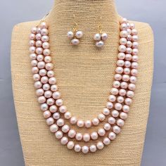 Gorgeous three strand freshwater pearl necklace and matching earrings. Perfect for a dressier occasion or a busy day at the office. Finished with a gold filled magnetic clasp. Measures approximately 17 inches. Can be adjusted upon request. Mom will love this! Pearl Necklace And Earrings, Necklace And Earrings Set, Freshwater Pearl Necklace, Busy Day, Freshwater Pearl Necklaces, Necklace And Earrings, Magnetic Clasp, Multi Strand, Earrings Set