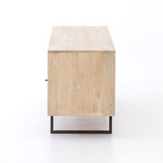 a small wooden cabinet with black metal legs