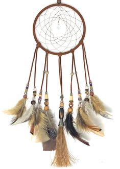 a brown and white dream catcher with feathers