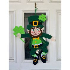 a st patrick's day decoration hanging on the front door