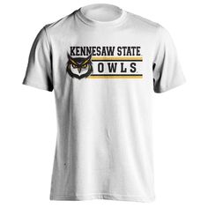 Kennesaw State University KSU Owls Classic Mascot Short Sleeve T-Shirt Show your Owls pride by wearing this Kennesaw State University Classic Mascot Logo t-shirt! This classic style tee shirt will quickly become your go-to shirt all year round. This tee is perfect for any Alumni or Student of KSU and wants everyone to know they are an Owl! High Quality Printed Graphic on front Rib collar for maximum comfort around the neck Solids 100% Cotton Heathers Poly/Cotton Blend Officially Licensed Product Basic Logo Print T-shirt For College, Graphic Tee With Team Name In Cotton, White Crew Neck T-shirt For School Spirit, Basic College T-shirt With Screen Print, Pre-shrunk Graphic Tee For College, White Cotton T-shirt For School Spirit, White Pre-shrunk College T-shirt, Basic College T-shirt With Logo Print, White School Spirit T-shirt With Logo Print