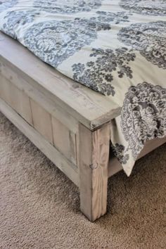 the bed is made and ready for someone to use it as a headboard or foot board