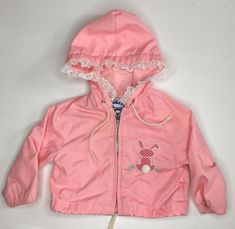 Vintage Pink Baby Jacket with Bunny Applique and Lace trim by Weather Tamer. Condition is "Pre-owned". Small tear in lining. Size 12months. Measurements taken flat. Pit to pit:11” Shoulder to hem:11” Hooded Outerwear With Drawstring Hood For Playtime, Spring Hooded Outerwear For Playtime, Cute Spring Outerwear With Drawstring Hood, Vintage Hooded Hoodie For Spring, Vintage Spring Outerwear With Drawstring Hood, Cotton Outerwear With Adjustable Hood For Playtime, Vintage Hooded Spring Outerwear, Vintage Pink Windbreaker For Spring, Vintage Embroidered Hooded Outerwear