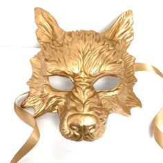 This unique golden masquerade mask set features a charming fox mask for your daughter and a fierce wolf mask for you. These masks symbolize the bond between a protective wolf and an adventurous fox. Let the magic of masquerade bring you closer and create treasured memories that will last a lifetime. Age Group/Gender - Adult/Kid Size/Type - One size fits all adults and children Mask Color - Gold Mask Material - Wolf: Polyresin. Fox: Laser cut metal Accent Material - Paint Animal Masquerade Mask, Masquerade Ball Prom, Werewolf Mask, Masquerade Mask Women, Fox Halloween, Couples Masquerade Masks, Werewolf Costume, Masquerade Ball Party, Costume Birthday Party