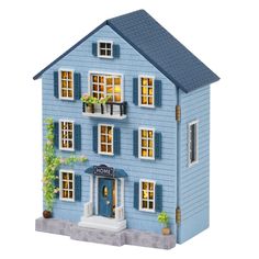 a blue doll house with windows and shutters on the front, sitting in front of a white background