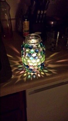 a glass jar sitting on top of a counter