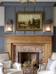 a living room filled with furniture and a fire place in front of a painting on the wall