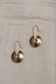 Inspired by West African culture, the 'Nkhando' Earrings (meaning 'Storage') offer a timeless design crafted with texture and bold dimension, making them an eye-catching piece. Made from brass coated in a luxuriously thick layer of 14k recycled gold with a unique texture, the Nkhando Earrings offer a versatile look for everyday wear, or for an elevated evening out. Pronounced 'Yay - Woh', YEWŌ Collective is a purpose-driven brand based in Malawi, Africa committed to creating growth, training, and employment opportunities for marginalized communities by designing and making elevated, timeless, and sustainable pieces that bring joy and authenticity to your everyday. Rooted in community, each piece of jewelry was intentionally designed and thoughtfully made at our solar-powered workshop in No Pierced Round Earrings In Recycled Gold, Pierced Round Recycled Gold Earrings, Pierced Round Recycled Gold Jewelry, Recycled Gold Round Jewelry, Round Recycled Gold Pierced Jewelry, Everyday Gold Recycled Gold Earrings, Everyday Hand Forged Bronze Earrings, Hammered Teardrop Recycled Gold Jewelry, Everyday Artisan Brass Jewelry