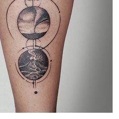 a tattoo on the leg of a woman with three planets and a sun in it