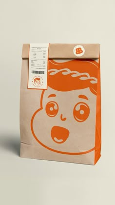 a brown bag with an orange face on it