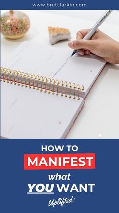 a person writing in a notebook with the title how to manifest what you want