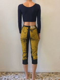 Amazing 1990s Jean Paul Gaultier vintage trompe l'oeil stretch jeans. Great vintage motorcycle jeans pattern. Perfection paired with a simple black crop top and choker. Jeans are made from a fairly light stretchy cotton and elastic denim. Front metal zipper with no waist band. Narrow jeans leg that slightly tapers towards the hem, cropped length. Label Gaultier Jeans, Size 36, 94% cotton, 6% spandex. Wash cool gentle, drip dry. Very good vintage condition with no fabric or sewing flaws. Measurem Fitted Grunge Denim Pants, High Waist Fitted Jeans For Alternative Fashion, High-waist Fitted Jeans For Alternative Fashion, Retro Fitted Jeans For Streetwear, Fitted Retro Jeans For Streetwear, Edgy Cropped Stretch Bottoms, Fitted Straight Leg Jeans For Alternative Fashion, Reworked Fitted Jeans For Streetwear, Fitted Cropped Bottoms For Streetwear