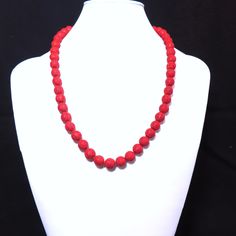 On offer is this Vintage 1960's Chinese Export Hand Carved Shou Design Red Cinnabar Necklace featuring a Gold Vermeil Sterling Filigree Box Clasp and Hand Knotted with red silk cord. Guaranteed to be genuine hand carved Cinnabar so you see some minor variance in the size and shape of the beads. Hallmark Silver on the clasp. The red Cinnabar beads measure 10 mm in diameter with a length of 22.5 inches. The clasp opens and closes tightly. This vintage necklace has never been worn and is old stock. Vintage Red Hand-strung Beaded Necklaces, Formal Red Coral Beaded Necklace, Traditional Red Beaded Necklace For Formal Occasions, Vintage Red 8mm Beaded Jewelry, Vintage Red Jewelry With 8mm Beads, Red Round Beads For Formal Occasions, Red Single Strand Beaded Necklace For Party, Formal Red Round Beads, Red Hand-strung Necklace For Wedding