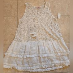 This Is An Italian Linen And Cotton Blend Dress By The Brand Scandal. It Is A Very Beachy Or Cottage Core Vibe. It's Os And Would Best Fit A Medium. This Would Also Be A Very Cute Coverup. Nwt Casual Lace Mini Dress For Day Out, Casual White Mini Dress For Summer Outings, Vacation Lace Sundress Mini Dress, Summer Lace Mini Dress For Vacation, Lace Summer Mini Dress For Vacation, Lace Sundress For Vacation, Casual Mini Dress With Crochet Trim, Lace Mini Dress For Summer Vacation, Lace Mini Dress For Vacation Beachwear