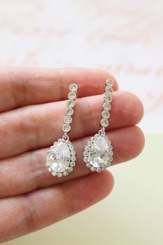 Tiny Vintage Style Bridal Earrings, Art Deco Earrings, Wedding Earrings Tiny  vintage style zircon  earrings  Colour: rhodium(silver tone) /clear Measurements: approx 3.6 cm x 1cm .  Materials:  rhodium components, zircon crystals . Stud earrings. Great for wedding or other celebration. MORE SAME STYLE: https://www.etsy.com/uk/shop/BridalArtDeco?ref=listing-shop-header-item-count&section_id=23918122 Please note some images have been enlarged to allow for details to be shown. Read the description White Teardrop Diamond Earrings For Wedding, Cubic Zirconia Bridal Earrings With Halo Design For Wedding, Hand-set Teardrop Crystal Earrings, Classic Cubic Zirconia Linear Earrings For Wedding, White Linear Earrings For Wedding, Teardrop Prong Setting Wedding Ring, White Teardrop Earrings With Prong Setting For Wedding, Elegant Drop Diamond Earrings For Wedding, Wedding Bridal Drop Earrings