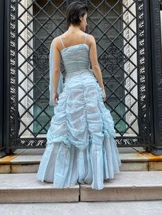 "50's one shoulder ball gown powder blue style w/ embroidered bodice and a skirt blended with different ruffles, drapes ending w/ 8 flowers at the bottom, long ribbon on one shoulder, metal zipper on the left, pink lining. Size S, strap 11\", bust 15\", waist 11.5\", length 59\", zipper 15\" Etsy Shipping -Vintage and pre-owned items may have signs of wear and use and are offered as is. Traces of age and use are therefore completely normal and do not constitute defects. Please see pictures as th One Shoulder Ball Gown, Powder Blue Gown, Purple Lace Dress, Green Silk Dresses, White Floral Print Dress, Dress And Jacket Set, Hoop Skirt, Gown Style, Embroidered Bodice