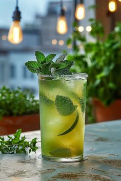 a green drink sitting on top of a table