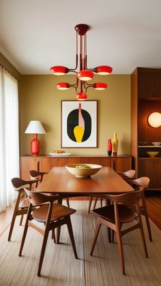 a dining room table with chairs and a painting on the wall in the back ground