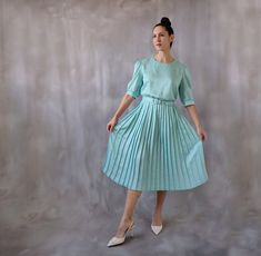 80s green midi dress with a pleated skirt, satin dress for a wedding guest, pearl buttons vintage tea dress or garden party dress - size M.  Super chic, elegant and classy midi dress made of a silky satin fabric in a aqua green color. Beatiful pleated skirt and maching belt.  ⊁ Color: aqua green, pale green. The backgound color is white but has the smallest green polka dots printed in different sizes all over the fabric, creating an all-green effect.  ⊁ The midi-length skirt boasts flattering pl Fairytale Prom Dress, Dress For A Wedding Guest, Ocassion Dress, Hollywood Gowns, Pure Silk Dress, Vintage Tea Dress, Vintage Ball Gowns, 80s Prom Dress, Dress For A Wedding