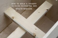 an unfinished wooden cross with the words how to build a cross on it's side