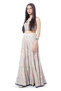 Chalk white crop top with all-over embroidery and low back with tassels. Comes with sharara.
Component: 2
Pattern: Embroidery
Type Of Work: Thread
Neckline: Round
Sleeve Type: Sleeveless
Fabric: Georgette
Color: White
Other Details: 
Tie up back
Note: Bracelets worn by the model are not for sale
Occasion: Destination Wedding - Aza Fashions Top And Sharara Set, Sharara Pants, Payal Singhal, Sharara Set, Chalk White, White Colour, White Crop Top, Embroidery Thread, Aza Fashion