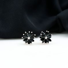 Product Details Add a pinch of spark to your outfit with these Stud Earrings, adorned with Marquise Shape Black Onyx Gemstone set in a floral pattern in Claw Setting. These lovely Floral Earrings are crafted in Solid Gold Metal Product Information SKU SHP-EARRINGS112112902 Length 9.5 mm Width 10 mm Weight 1.52 gm (Approximate) BLACK ONYX INFORMATION No.of Stones 24 Pieces Total Weight 3.10 Carat (Approximate) Dimension(approx) Marquise-2X4 mm-24 Pcs Color Black Cut Brilliant Shape Marquise Setti Marquise Setting, Statement Stud Earrings, Black Stud Earrings, Black Stud, Claw Setting, Onyx Gemstone, Floral Earrings, Black Onyx, Gold Metal