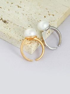 Product Details:Material: S925 silver/natural pearlSize: The pearl is about 11mm, and the adjustable finger ring is about US size 6~8Describe:Introducing our Pearl Ring: A sleek and sophisticated accessory that effortlessly enhances your daily attire. Crafted with genuine S925 silver and adorned with natural pearls, available in both classic silver and vintage gold. Elevate your look with this timeless piece that exudes confidence and refinement. Open Ring With Pearl Drop, Classic White Pearl Ring With Simple Design, Minimalist Pearl Rings With Pearl Charm, Pearl Drop Open Ring, Minimalist Pearl White Ring With Pearl Drop, Minimalist Pearl White Pearl Ring, Minimalist Formal Pearl Drop Ring, White Pearl Open Ring, Minimalist Pearl Ring For Formal Occasions