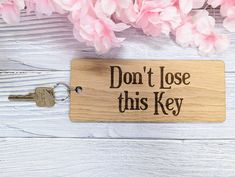 "🔑 The Ultimate Reminder Keyring! Say goodbye to misplaced keys with our extra-large, 200x80mm wooden keyring. Engraved with the straightforward message \"Don't Lose This Key,\" this keyring is perfect for anyone who needs a little extra reminder or has an important key to keep track of. 🎉 No More Lost Keys This keyring is not just a statement piece; it's a practical solution for those who frequently misplace their keys. Its large size makes it hard to lose, and the bold message serves as a constant reminder. 🌳 Quality You Can Trust Made from premium wood, this keyring is not only large but also incredibly durable. The natural wood grain adds a touch of rustic charm to each piece, making it unique. 🎁 Ready for Gifting Looking for a quirky yet practical gift? This keyring comes ready fo Personalised Wooden Gifts, Lost Keys, Wooden Tags, Tape Crafts, Wood Craft, Jute Bags, First Car, Gift Wrapping Services, Custom Keychain