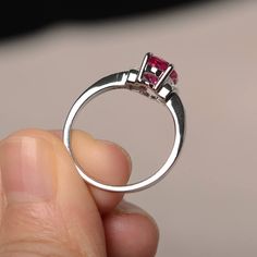 This is a gorgeous handmade creation. Its beauty is its simplicity & Elegance. The 6*8mm oval cut lab ruby is crafted in solid sterling silver and with rhodium plated. It is available to customized, if you have any mind, just let me know, we will discuss with it. All item is sent in a beautiful gift box You can realize more lovely stuff clicking the link https://www.etsy.com/shop/knightjewelry?refshopsection_shophome_leftnav Please leave the correct address and you PHONE NUMBER for deliverin Red Oval Birthstone Ring With Prong Setting, Red Oval Sapphire Birthstone Ring, Oval Ruby Birthstone Ring With Halo Setting, Oval Ruby Birthstone Ring With Accent Stones, Oval Ruby Diamond Ring With Prong Setting, Red Sapphire Ring With Accent Stones, Oval Shape, Red Sapphire Ring With Oval Shape And Accent Stones, Valentine's Day Oval Diamond Ring With Prong Setting, Ruby Ring With Accent Stones In Round Band