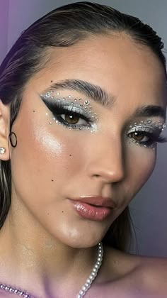 Silver Makeup With Rhinestones, Silver Fantasy Makeup, 2023 Prom Makeup, White Silver Eye Makeup, Silver Glittery Eye Makeup, Space Makeup Futuristic Make Up, White And Silver Eye Makeup, Silver Sparkle Makeup, Silver Glitter Makeup Looks